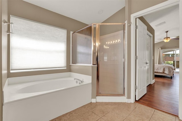 211 Tavestock Loop, Winter Springs, FL 32708 - full bath with a bath, ensuite bathroom, a stall shower, tile patterned flooring, and ceiling fan