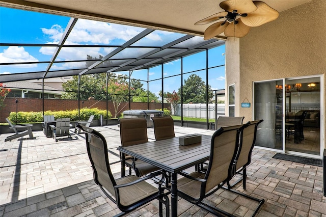 211 Tavestock Loop, Winter Springs, FL 32708 - fenced backyard featuring a patio area, outdoor dining space, glass enclosure, and ceiling fan