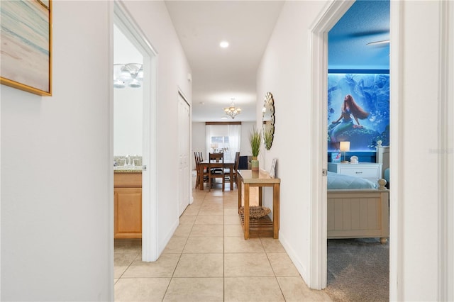 3193 Pequod Pl, Kissimmee, FL 34746 - hall featuring light tile patterned floors and a sink