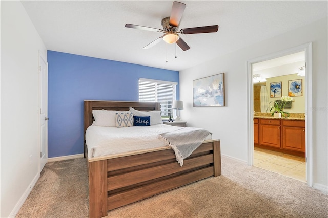 3193 Pequod Pl, Kissimmee, FL 34746 - bedroom featuring light carpet, ensuite bathroom, and a ceiling fan
