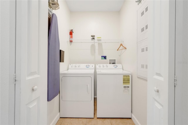 3193 Pequod Pl, Kissimmee, FL 34746 - laundry area featuring washer and clothes dryer and light tile patterned floors
