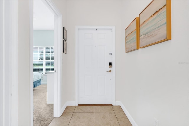 3193 Pequod Pl, Kissimmee, FL 34746 - doorway to outside with light tile patterned floors and baseboards