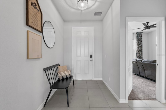 944 Benjamin Trl, Davenport, FL 33837 - entryway with light tile patterned flooring and ceiling fan