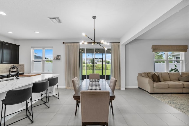 944 Benjamin Trl, Davenport, FL 33837 - dining area with a chandelier, recessed lighting, and light tile patterned flooring