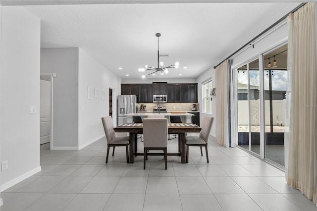 944 Benjamin Trl, Davenport, FL 33837 - dining area with a chandelier, recessed lighting, and light tile patterned floors