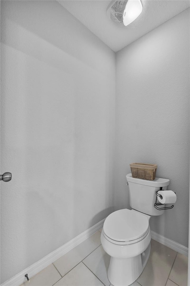 944 Benjamin Trl, Davenport, FL 33837 - bathroom with tile patterned floors and toilet
