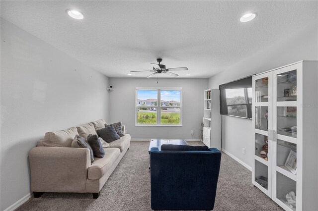 944 Benjamin Trl, Davenport, FL 33837 - living area featuring carpet floors, a textured ceiling, healthy amount of natural light, ceiling fan, and recessed lighting