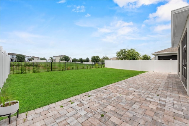 944 Benjamin Trl, Davenport, FL 33837 - fenced backyard featuring a patio area, a garage, and decorative driveway