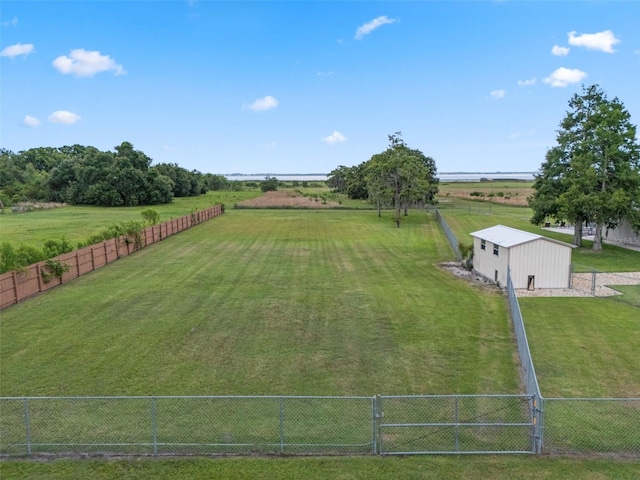 2921 Lake Tohopekaliga Blvd, Kissimmee, FL 34746 - view of yard featuring a view of rural / pastoral area and an outbuilding