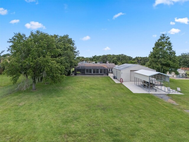 2921 Lake Tohopekaliga Blvd, Kissimmee, FL 34746 - view of grassy yard featuring a carport