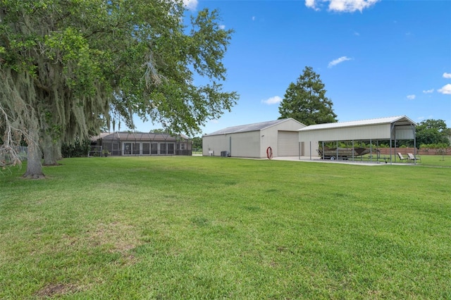 2921 Lake Tohopekaliga Blvd, Kissimmee, FL 34746 - view of green lawn featuring an outbuilding, an outdoor structure, and a carport