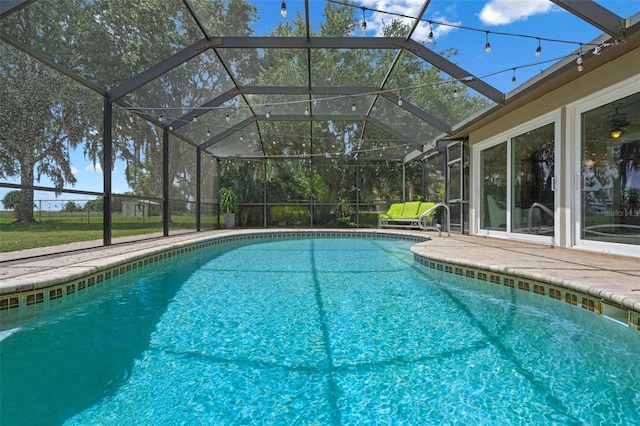 2921 Lake Tohopekaliga Blvd, Kissimmee, FL 34746 - swimming pool with a patio area and glass enclosure