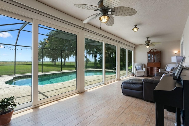2921 Lake Tohopekaliga Blvd, Kissimmee, FL 34746 - sunroom / solarium with ceiling fan and a swimming pool