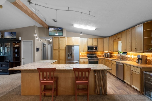 2921 Lake Tohopekaliga Blvd, Kissimmee, FL 34746 - kitchen featuring appliances with stainless steel finishes, open shelves, vaulted ceiling, decorative backsplash, and a large island