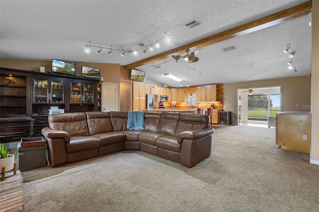 2921 Lake Tohopekaliga Blvd, Kissimmee, FL 34746 - living room with light carpet, track lighting, and a ceiling fan