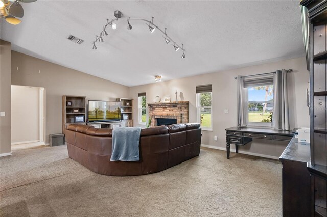 2921 Lake Tohopekaliga Blvd, Kissimmee, FL 34746 - living room featuring light carpet and a brick fireplace