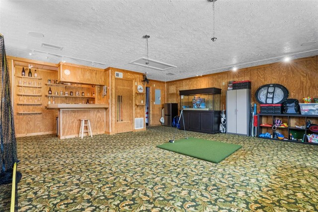2921 Lake Tohopekaliga Blvd, Kissimmee, FL 34746 - recreation room featuring attic access, a textured ceiling, wood walls, and electric panel