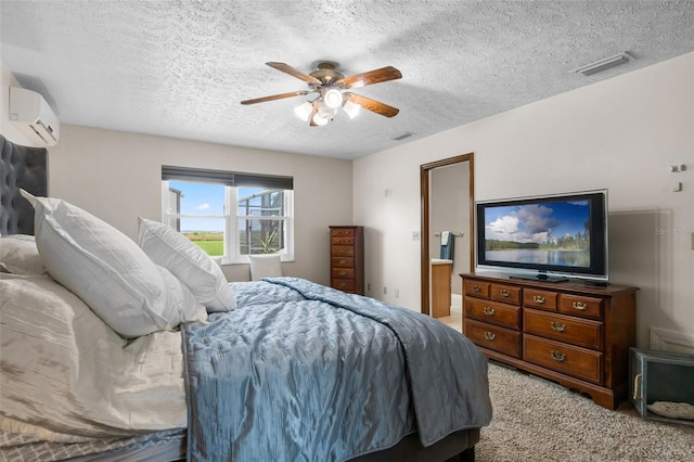 2921 Lake Tohopekaliga Blvd, Kissimmee, FL 34746 - bedroom with a wall mounted AC, light colored carpet, a ceiling fan, and a textured ceiling