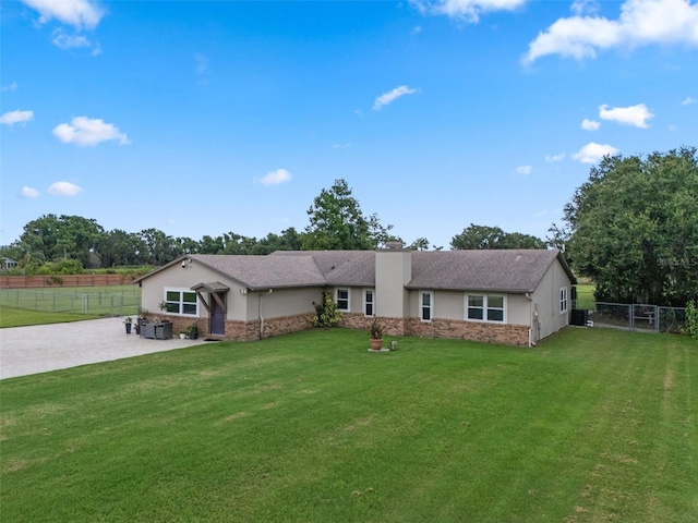 2921 Lake Tohopekaliga Blvd, Kissimmee, FL 34746 - single story home with stucco siding, a patio area, a fenced backyard, and a chimney