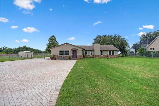 2921 Lake Tohopekaliga Blvd, Kissimmee, FL 34746 - ranch-style home featuring a chimney, driveway, and stucco siding