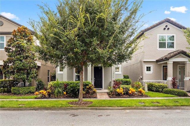 14536 Golden Harbor Ln, Winter Garden, FL 34787 - view of front of property featuring a tiled roof and stucco siding