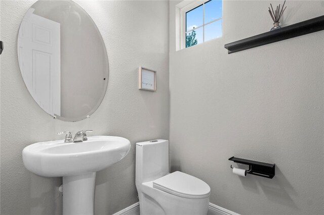 14536 Golden Harbor Ln, Winter Garden, FL 34787 - bathroom featuring toilet and baseboards