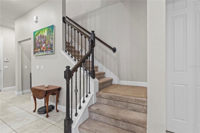 14536 Golden Harbor Ln, Winter Garden, FL 34787 - stairs with baseboards and tile patterned floors