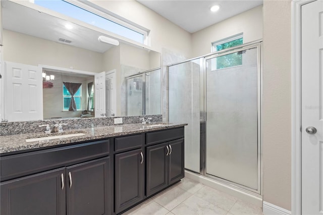 14536 Golden Harbor Ln, Winter Garden, FL 34787 - full bath featuring double vanity, a stall shower, and tile patterned flooring