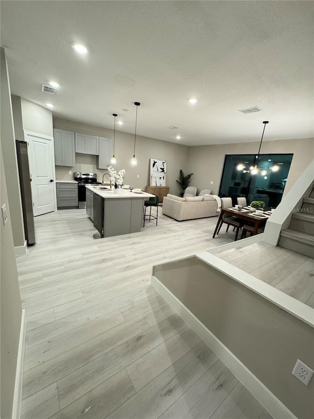 1526 Hempel Ave, Gotha, FL 34734 - living room with recessed lighting and light wood finished floors