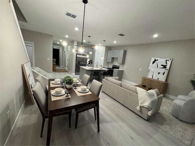 1526 Hempel Ave, Gotha, FL 34734 - dining area with light wood-style flooring and recessed lighting