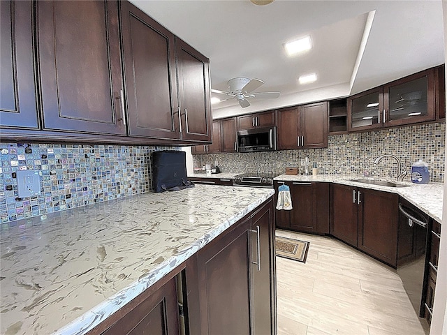 2400 Presidential Way Unit 1104, West Palm Beach, FL 33401 - kitchen featuring stainless steel microwave, dishwasher, decorative backsplash, and a ceiling fan