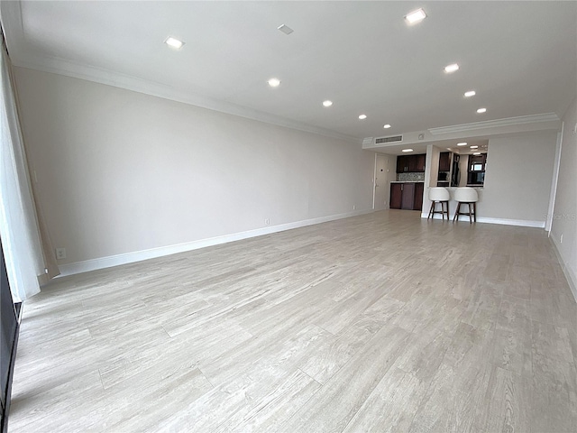 2400 Presidential Way Unit 1104, West Palm Beach, FL 33401 - unfurnished living room with crown molding, recessed lighting, and light wood finished floors