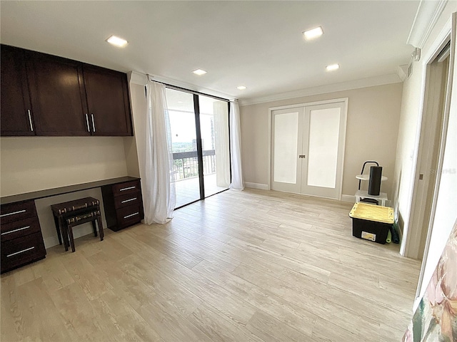 2400 Presidential Way Unit 1104, West Palm Beach, FL 33401 - unfurnished living room featuring crown molding, french doors, light wood finished floors, and recessed lighting