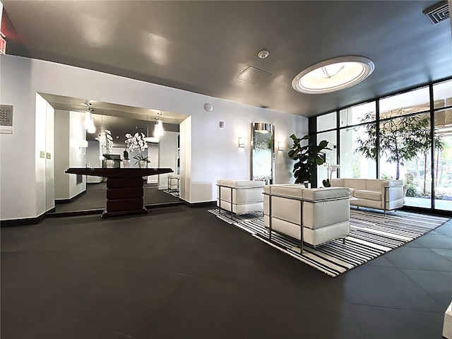 2400 Presidential Way Unit 1104, West Palm Beach, FL 33401 - common area with floor to ceiling windows