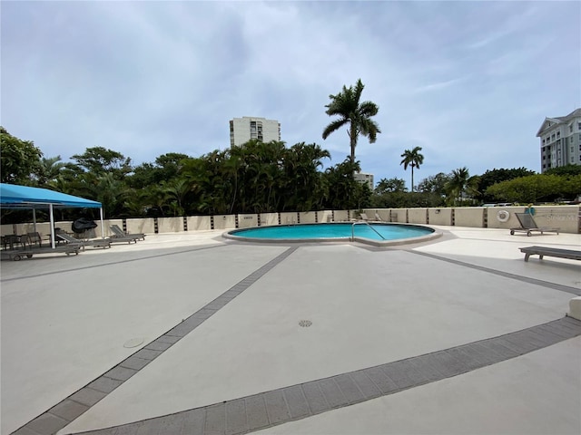 2400 Presidential Way Unit 1104, West Palm Beach, FL 33401 - community pool featuring a patio