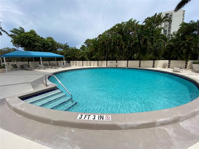 2400 Presidential Way Unit 1104, West Palm Beach, FL 33401 - community pool featuring a patio