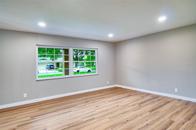 5938 Marlberry Dr, Orlando, FL 32819 - spare room with wood finished floors and recessed lighting