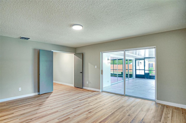 5938 Marlberry Dr, Orlando, FL 32819 - empty room featuring wood finished floors and a textured ceiling