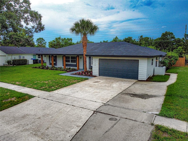 5938 Marlberry Dr, Orlando, FL 32819 - single story home with an attached garage, a front lawn, and concrete driveway