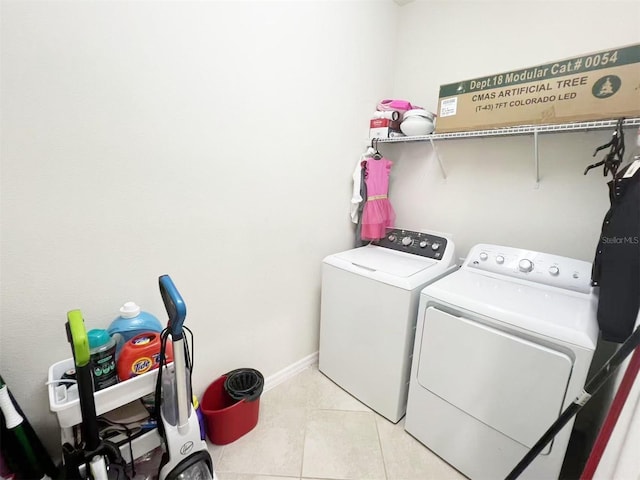17504 Butterfly Pea Ct, Clermont, FL 34714 - washroom with washer and clothes dryer and light tile patterned flooring