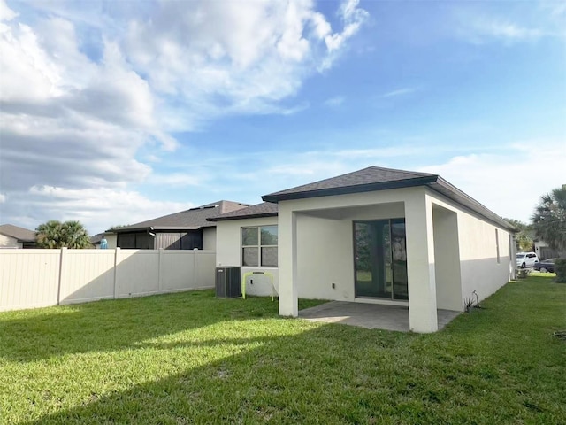 17504 Butterfly Pea Ct, Clermont, FL 34714 - back of property with a patio, stucco siding, and a shingled roof