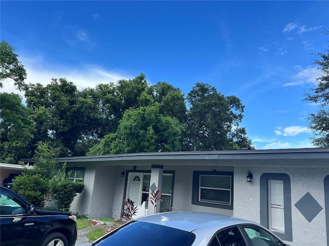 223 Hope Cir, Orlando, FL 32811 - single story home featuring stucco siding and a porch