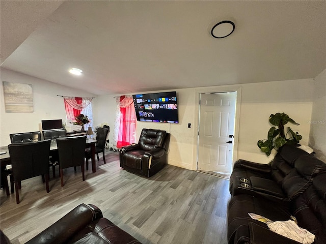 223 Hope Cir, Orlando, FL 32811 - living area featuring wood finished floors and lofted ceiling