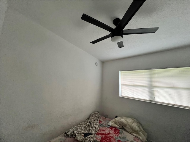 223 Hope Cir, Orlando, FL 32811 - bedroom with a ceiling fan and a textured ceiling