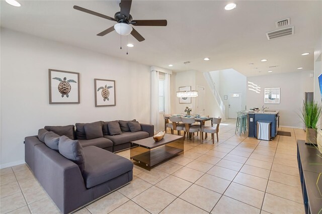 2108 Morocco Way, Kissimmee, FL 34747 - living area featuring plenty of natural light, light tile patterned floors, a ceiling fan, recessed lighting, and a chandelier