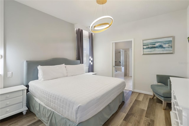 2108 Morocco Way, Kissimmee, FL 34747 - bedroom with wood finished floors and ensuite bathroom