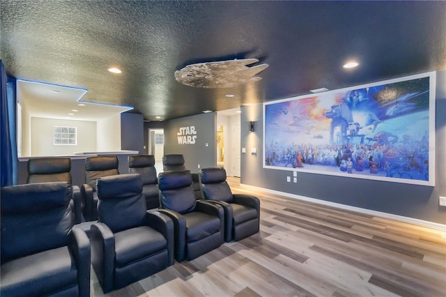 2108 Morocco Way, Kissimmee, FL 34747 - cinema room with wood finished floors, recessed lighting, and a textured ceiling