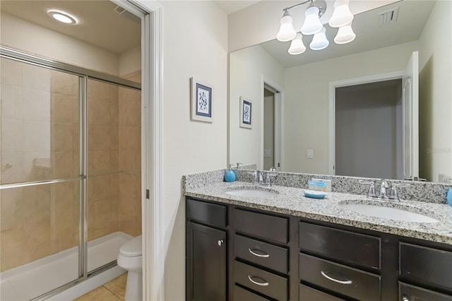 2108 Morocco Way, Kissimmee, FL 34747 - bathroom with double vanity, tile patterned flooring, a stall shower, and a chandelier