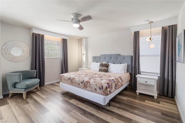 2108 Morocco Way, Kissimmee, FL 34747 - bedroom with wood finished floors, a textured ceiling, and a ceiling fan