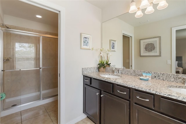 2108 Morocco Way, Kissimmee, FL 34747 - full bathroom featuring double vanity, tile patterned flooring, a stall shower, and a chandelier